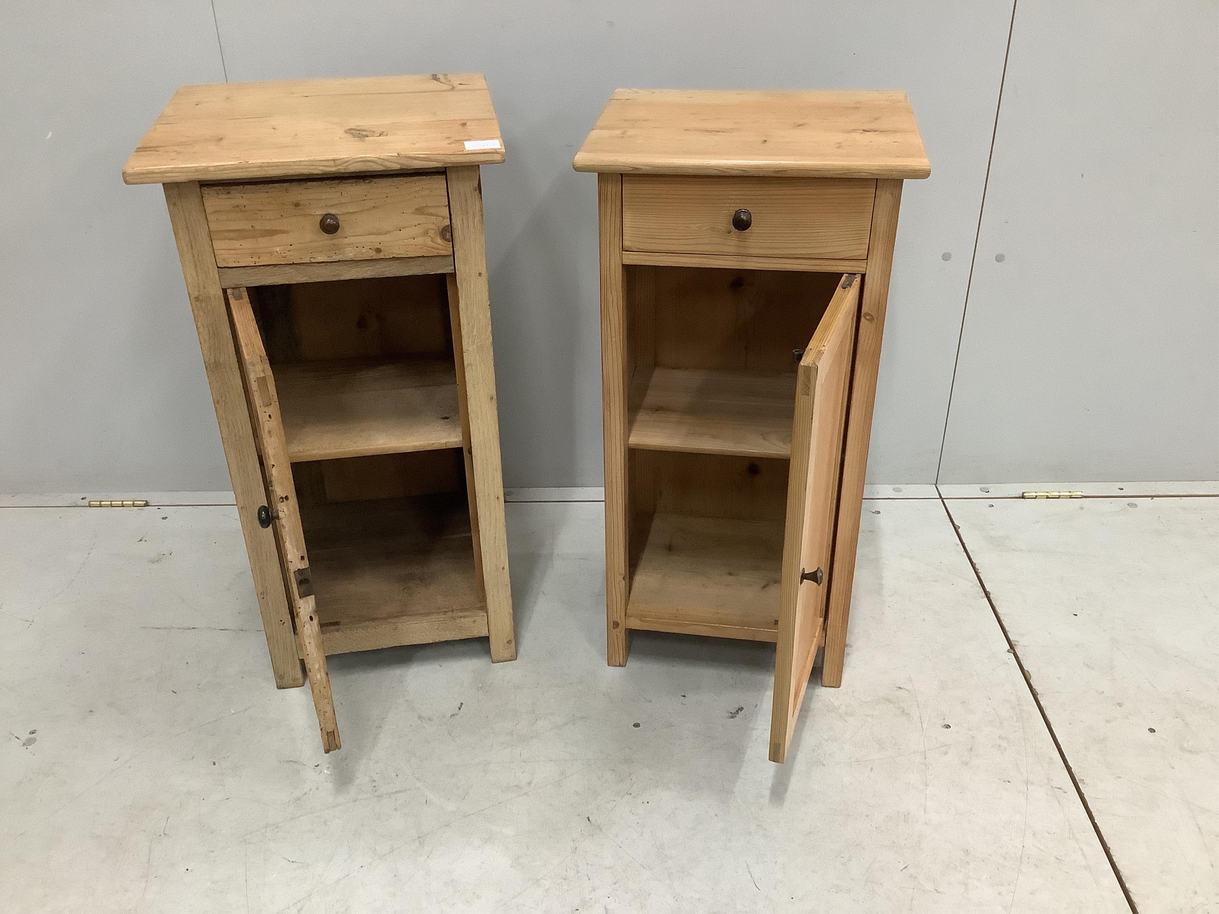 A near pair of East European pine bedside cabinets, width 42cm, depth 38cm, height 80cm. Condition - fair, one with evidence of worm, now inactive